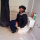 A guy breaks into the bathroom to reveal an angry black girl taking a shit. Although we cannot hear any poop action, it is implied. She throws everything she can at the cameraman except the turd in the toilet!